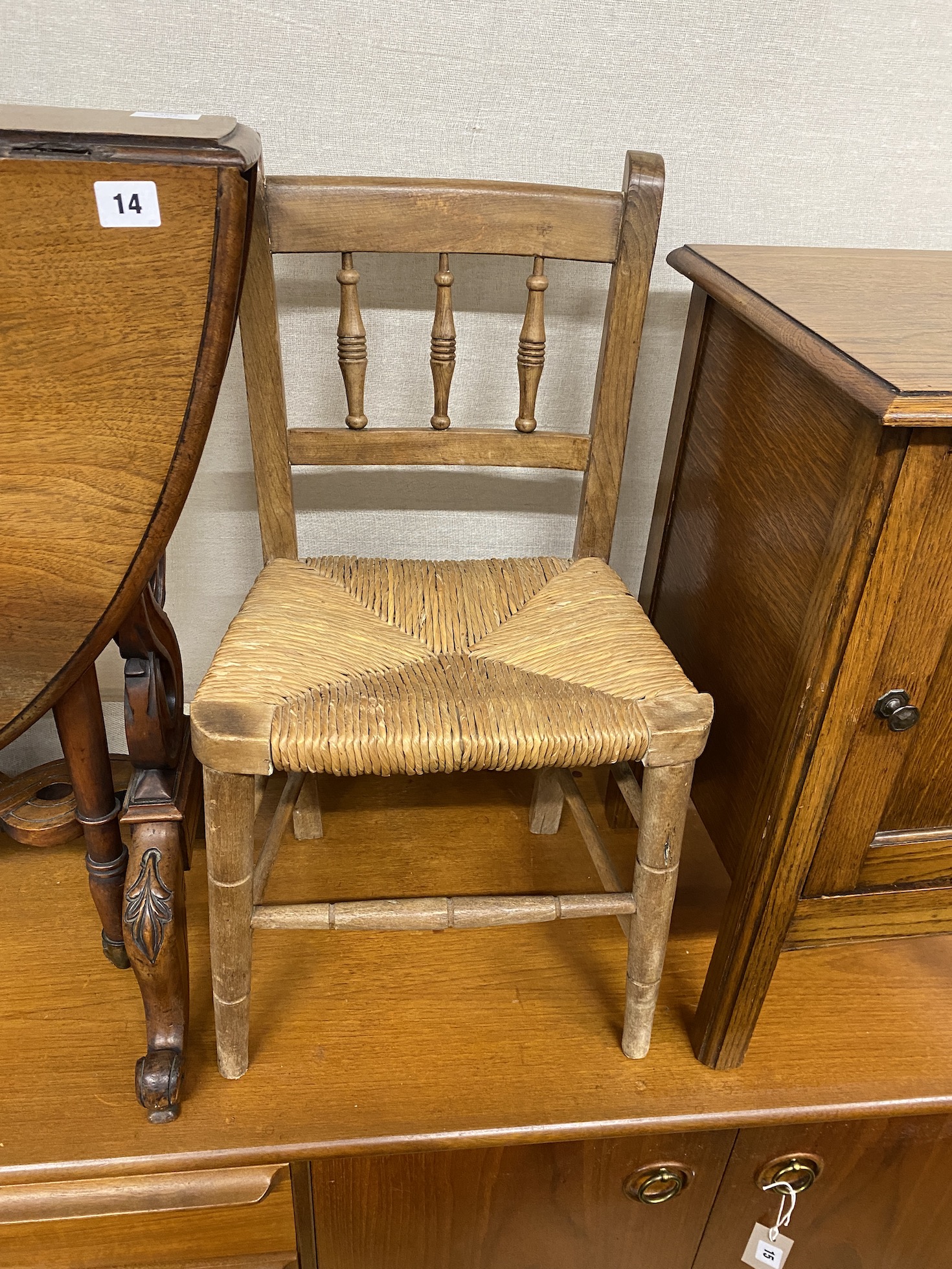 A late Victorian mahogany bedside cabinet, height 78cm, a later oak cabinet and a rush seat child's chair